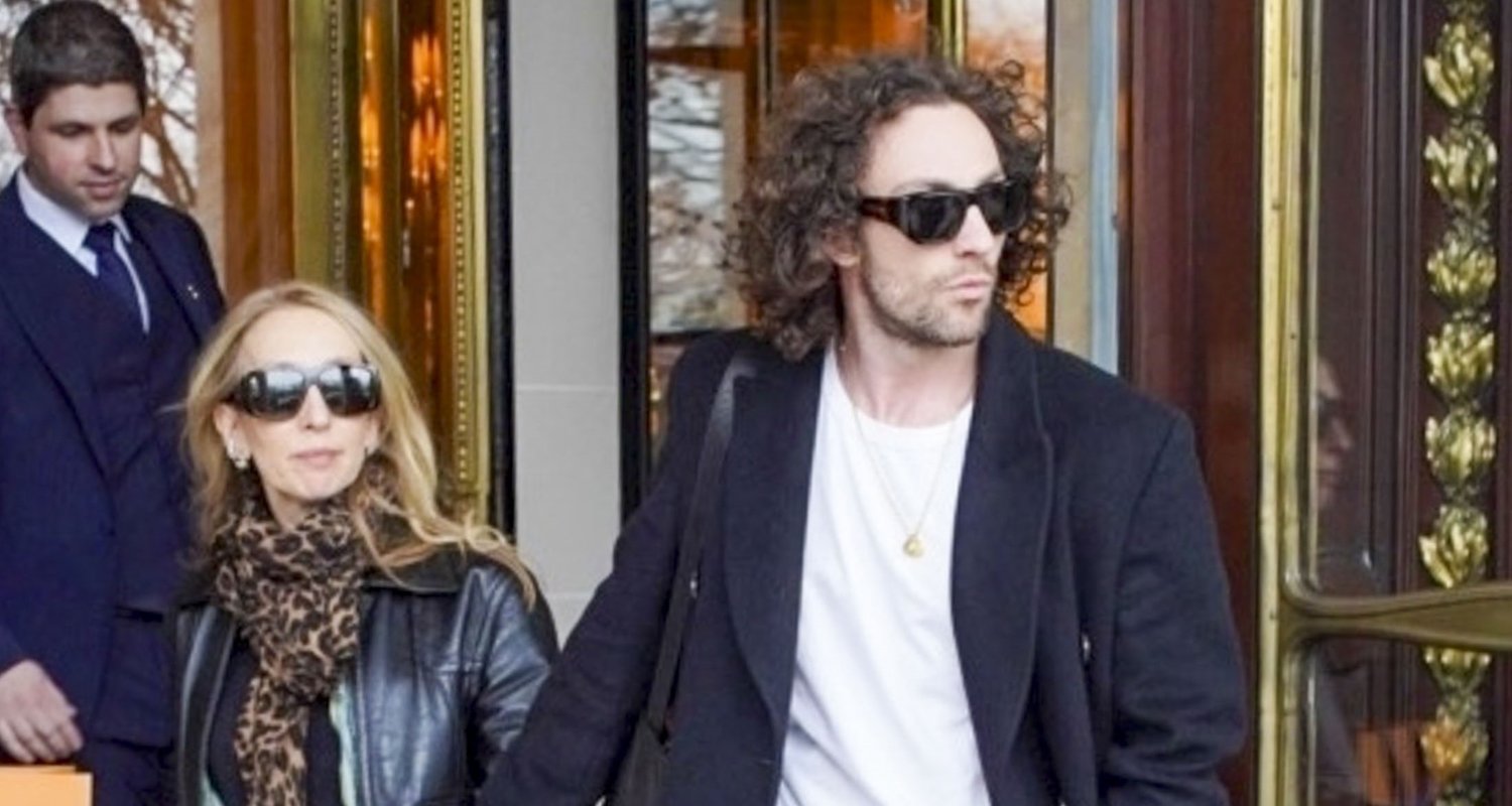 Aaron Taylor-Johnson & Wife Sam Hold Hands as They Check Out of Paris Hotel | aaron taylor johnson, sam taylor johnson | Celebrity News and Gossip | Entertainment, Photos and Videos
