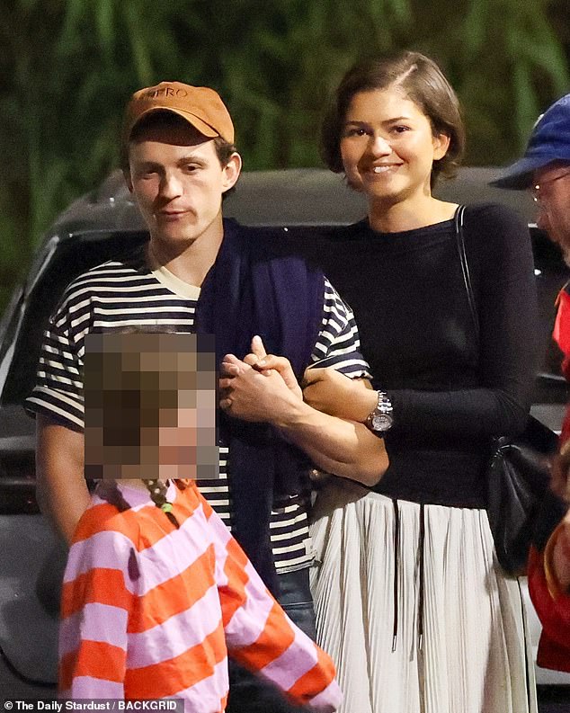 Zendaya wears gold ring as she and Tom Holland look loved up on first sighting together since wedding rumors