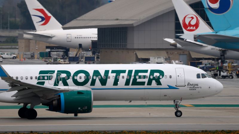 Close call at LAX: Frontier Airlines jet slams on the brakes when two trucks cross its path