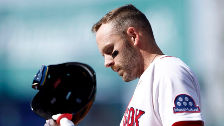 Boston Red Sox shortstop Trevor Story (10) reacts after grounding out resulting in a double play to end the fifth inning during the season home opener against the San Diego Padres at Fenway Park on April 3, 2026 in Boston.