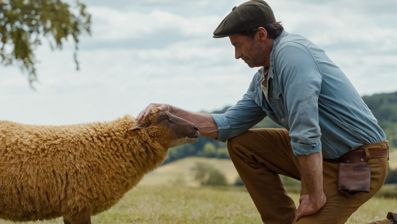 (L to R) Julia-Louis Dreyfus as the voice of Lily, the sheep, and Hugh Jackman as George Hardy in The Sheep Detectives, from Amazon MGM Studios.