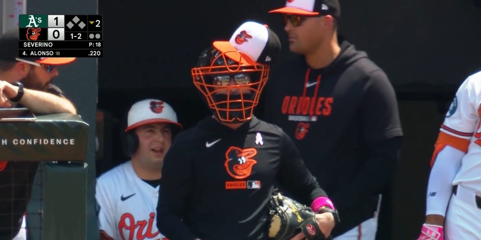 Craig Albernaz, Orioles manager, wears catcher’s mask, glove in dugout