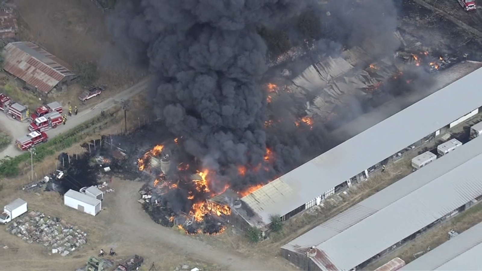 Firefighters battling 5‑acre brush and structure fire in Livermore on Tesla, Greenville roads