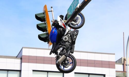 Motorcyclist seriously injured after crash leaves bike dangling from traffic light near Surrey-Delta border