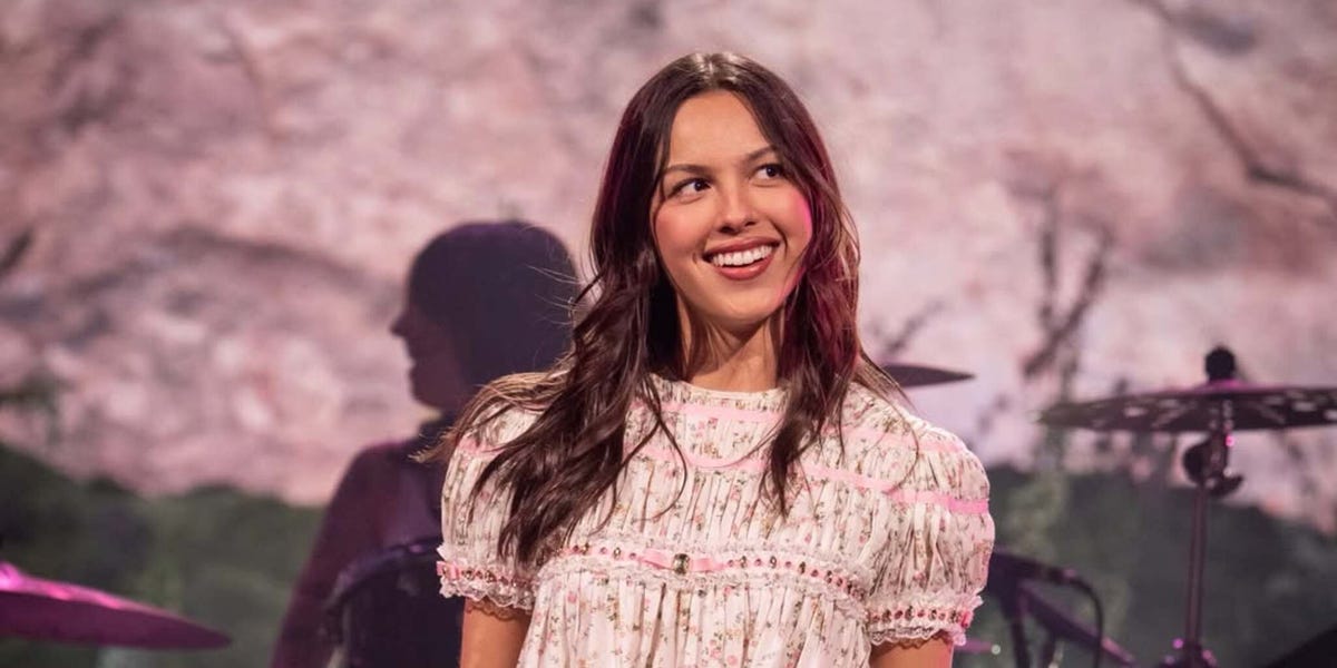 Olivia Rodrigo Performs in Barcelona in a Babydoll Dress and Boots