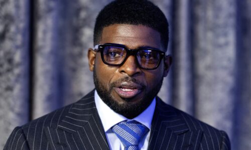 Former Montreal Canadiens star P.K. Subban dressed in a blue suit.